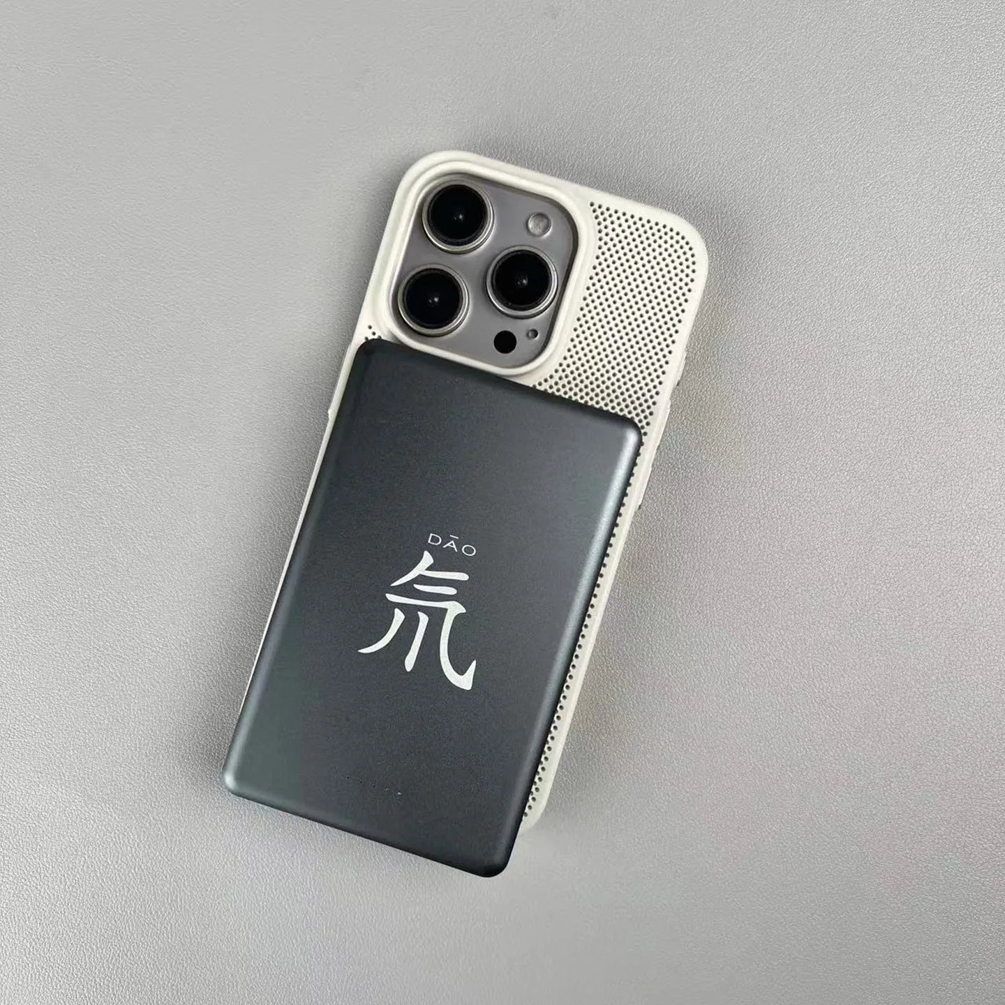 Frosted magnetic hard phone case for IPhone on a table, showing colour options.