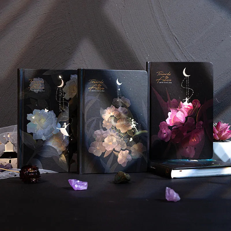 A5 notebook with luminous cover open to show colour illustrated interior pages
