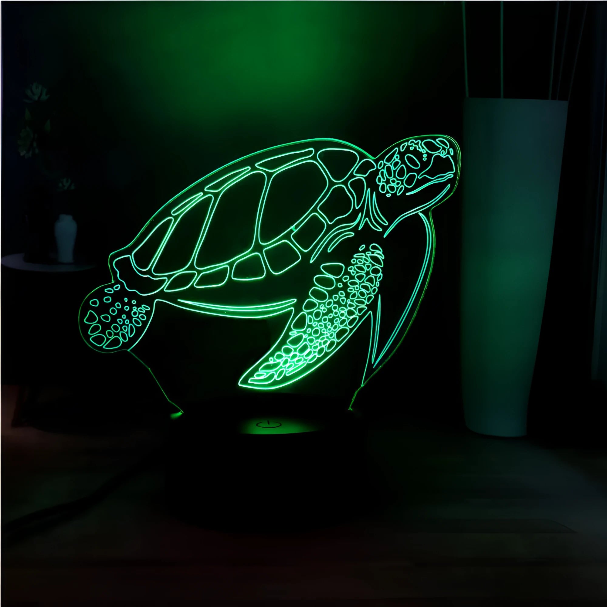 3D transparent acrylic turtle-shaped LED night light glowing with coloured light.