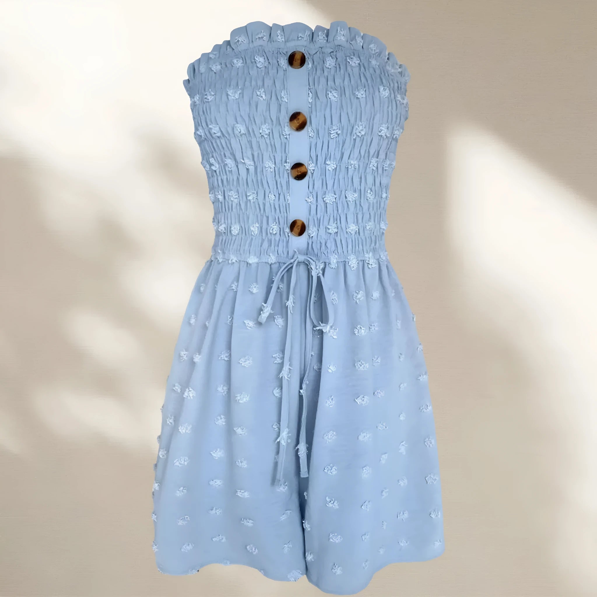 Solid colour off-shoulder sleeveless women's jumpsuit on a hanger, showing button detail and mid-waist design.