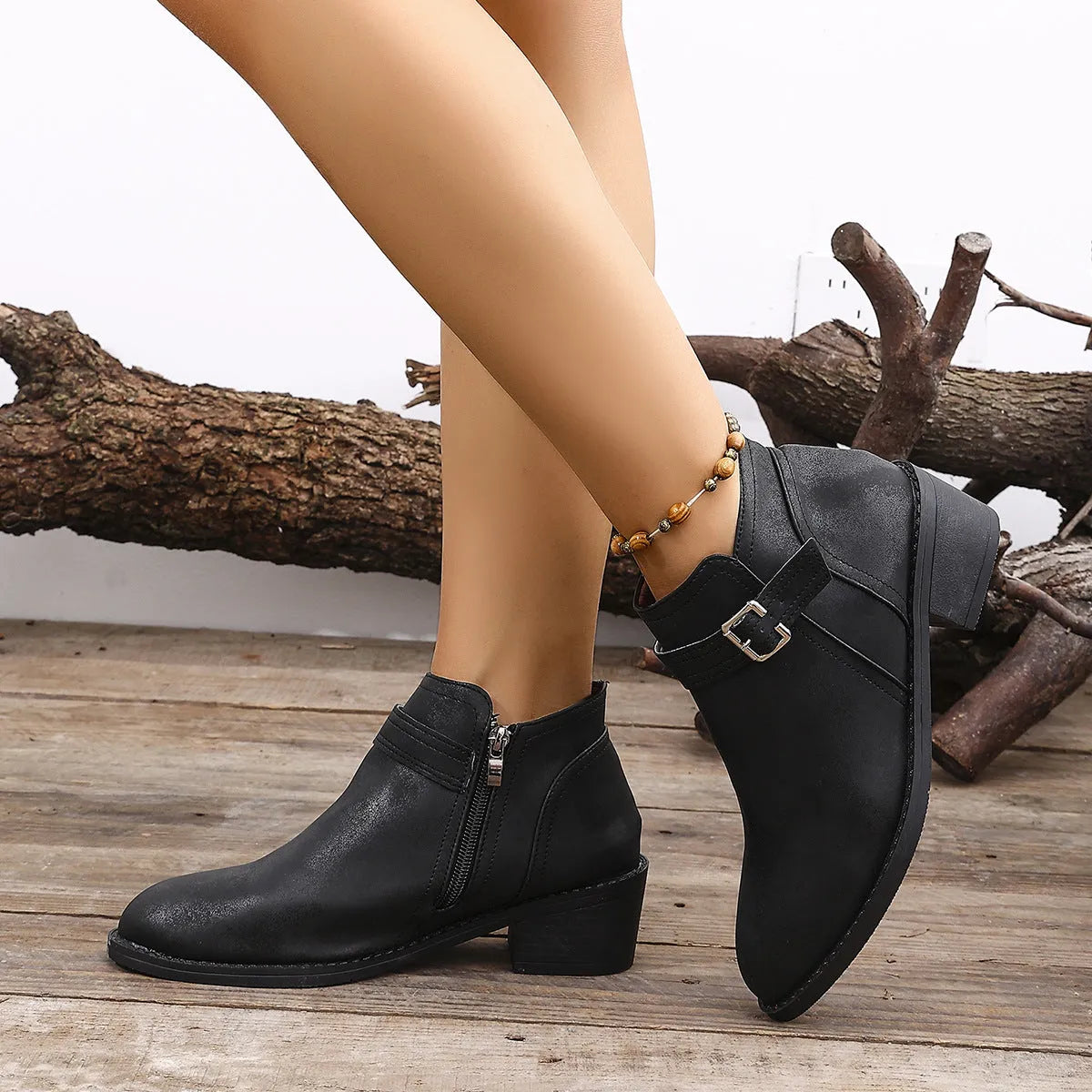 Autumn pointed female boots with chunky heel and belt buckle detail in black