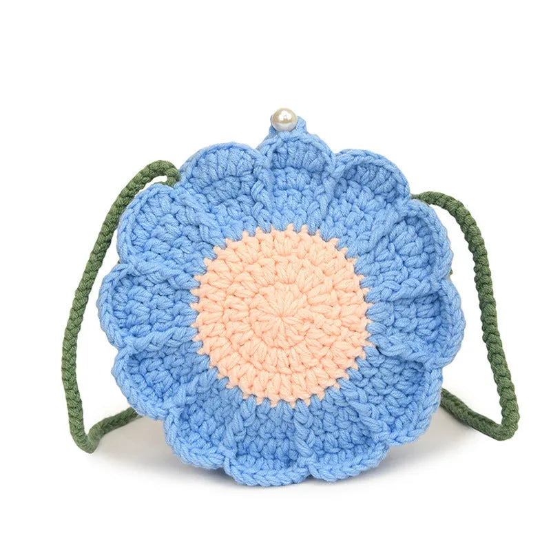 Hand-woven crochet bag with wool flowers in round suitcase shape with cotton lining