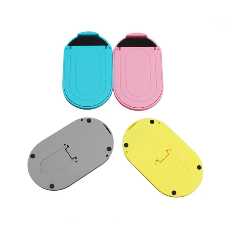 Plastic lazy bracket mobile phone stand in multiple colour options on desk