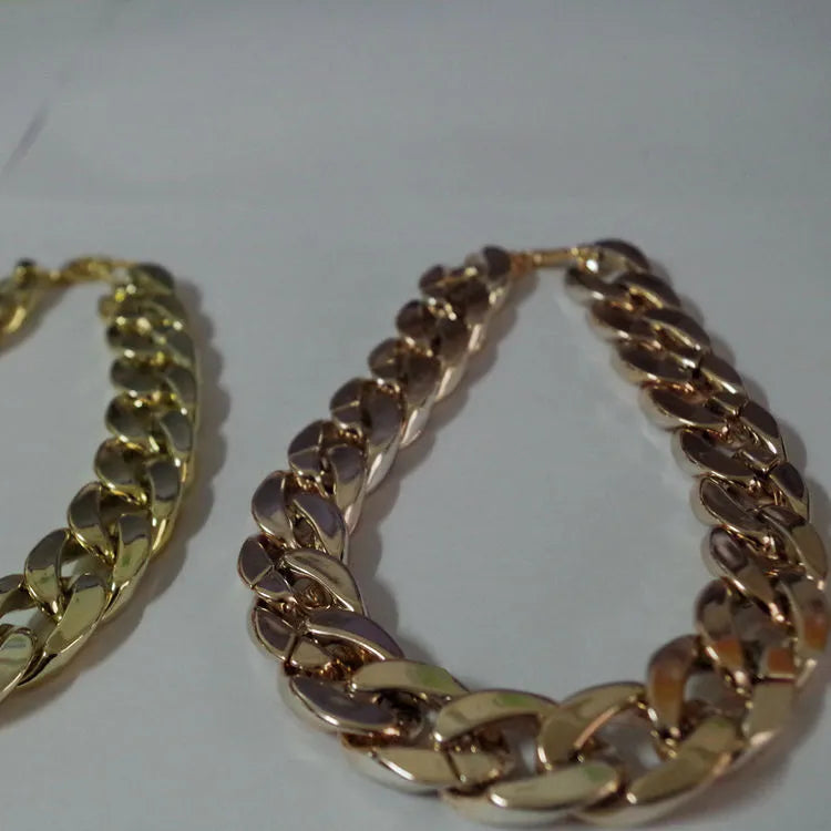 Gold-plated pet dog necklace with extender chain, gold finish, on a small dog