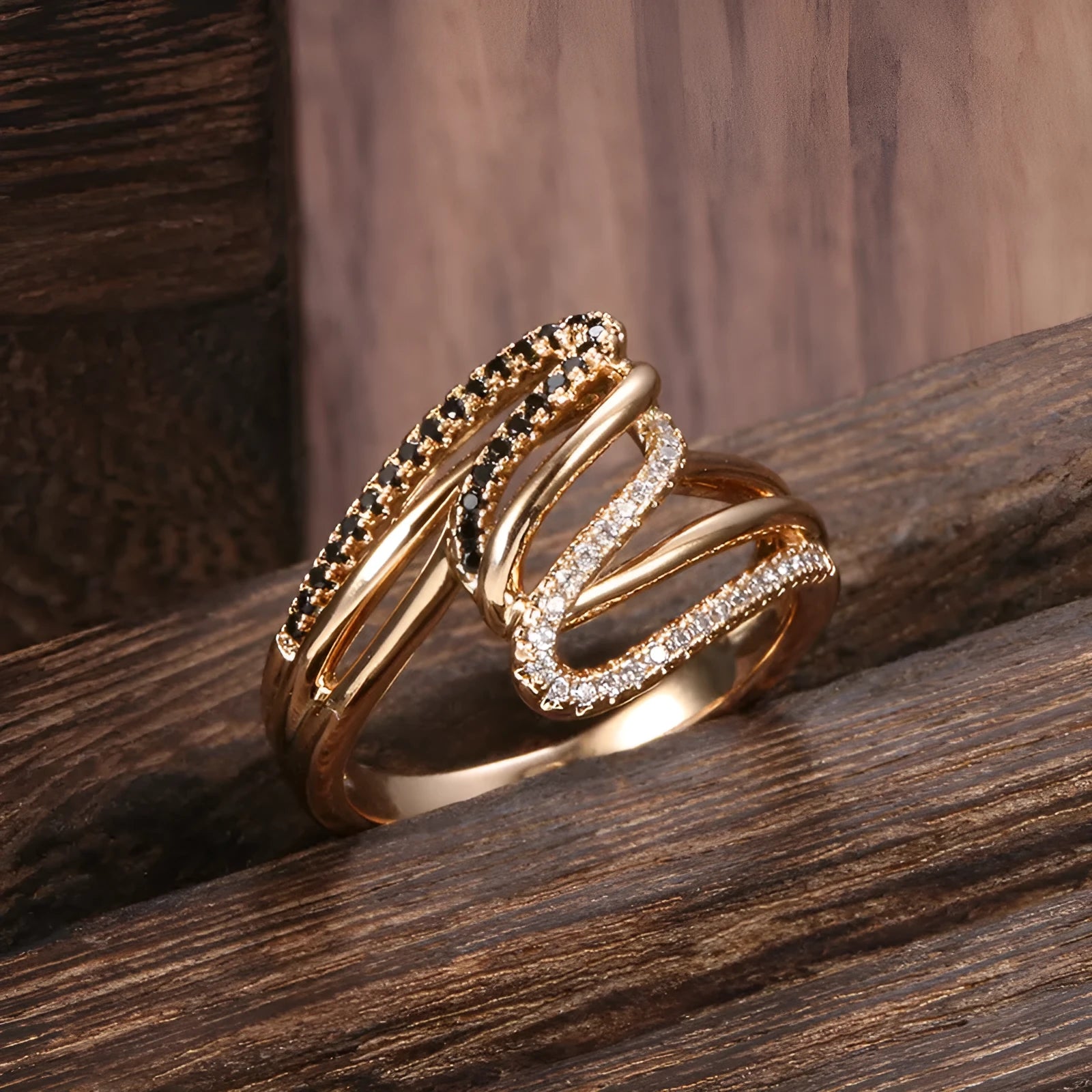 Close-up of a women's copper ring with micro-inlaid zircon stones and an electroplated finish.