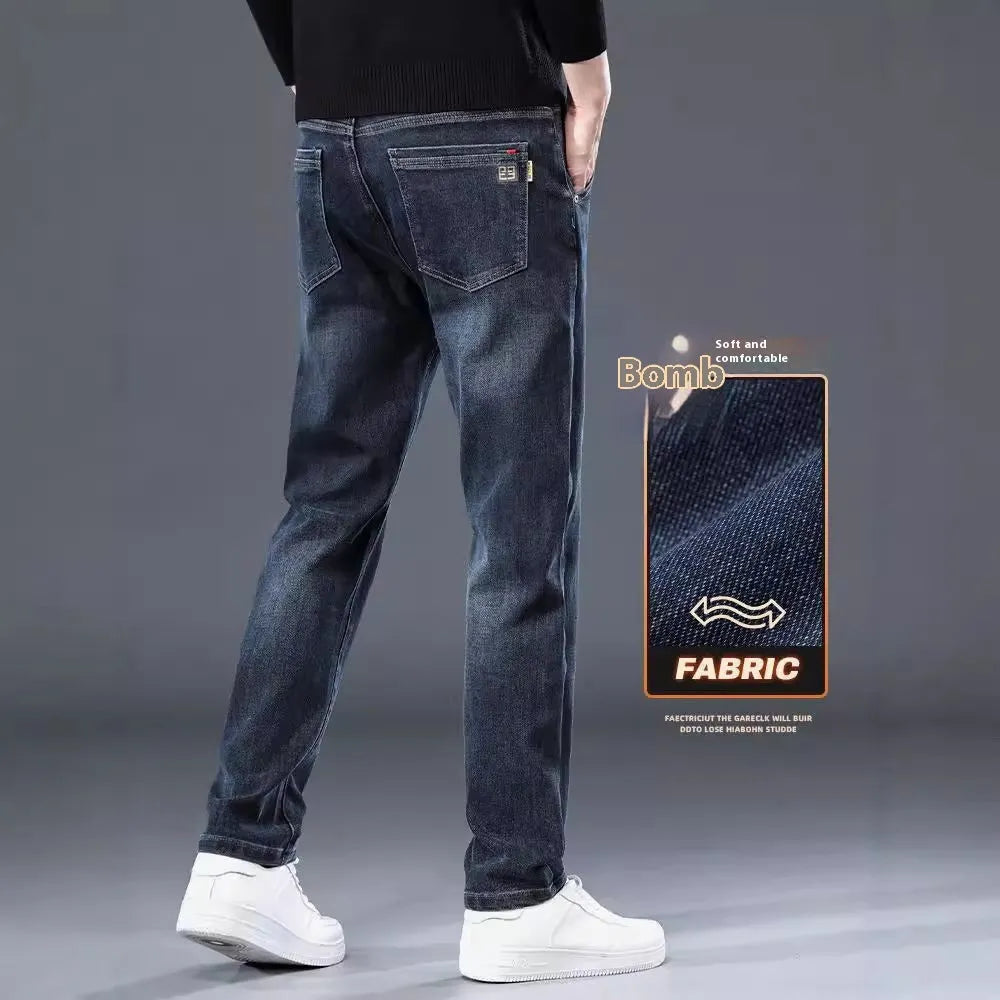 Blue grey slim straight loose casual trousers on a hanger, showing mid waist and zipper fly.