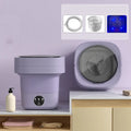 Foldable portable mini washing machine in green colour with drain pipe and basket