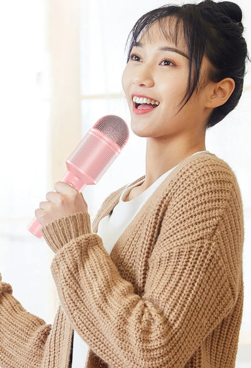 Wireless Bluetooth karaoke microphone in pink, blue, or green colour.