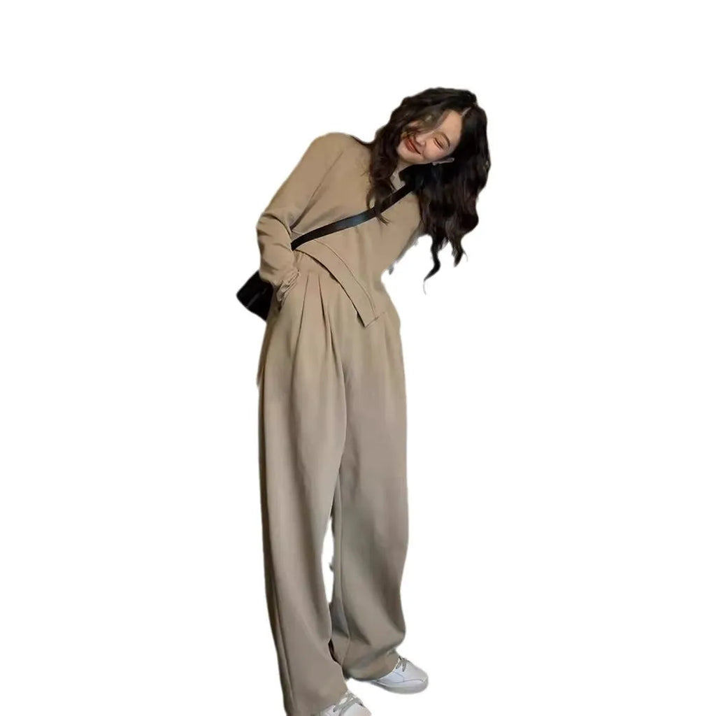 Women's loose khaki casual sports suit set with long sleeves and trousers on a hanger.