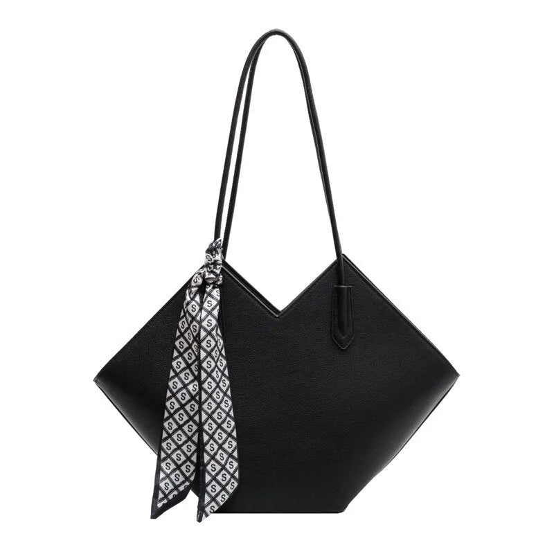 Women's large black PU shoulder bag with square shape and top handle on a neutral background
