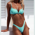 Women's thong bikini swimsuit in polyester with lining, shown in black, blue, pink, or white, sizes S M L