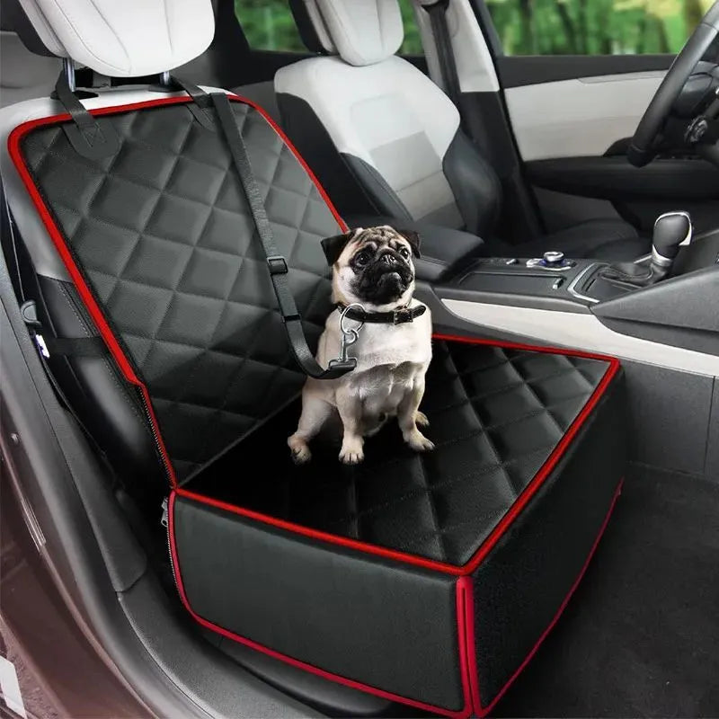 Large square black dog car seat protector with non-slip base on a vehicle front seat.