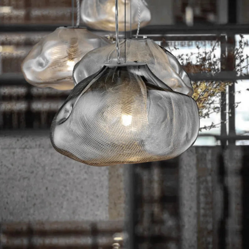 Modern fabric chandelier with glass shade in clear, amber, or smoke grey colour options.