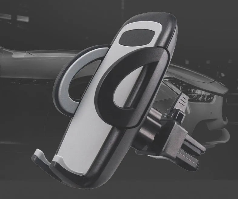 Black plastic universal mobile phone holder mounted on car air vent
