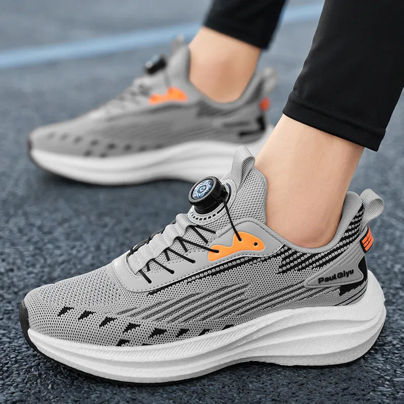 Men's white and green casual running shoes with rotating buckle and Fly-knit mesh upper on a flat TPU sole.