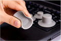 Grey durable plastic laptop cooling pads, two large and two small, on a desk.