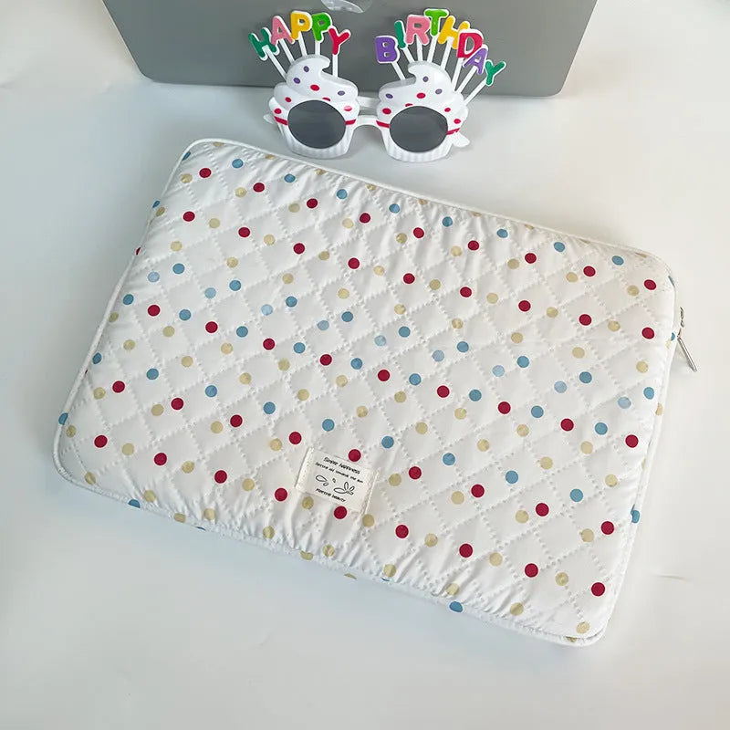 Women's polka dot polyester laptop bag showing three size options
