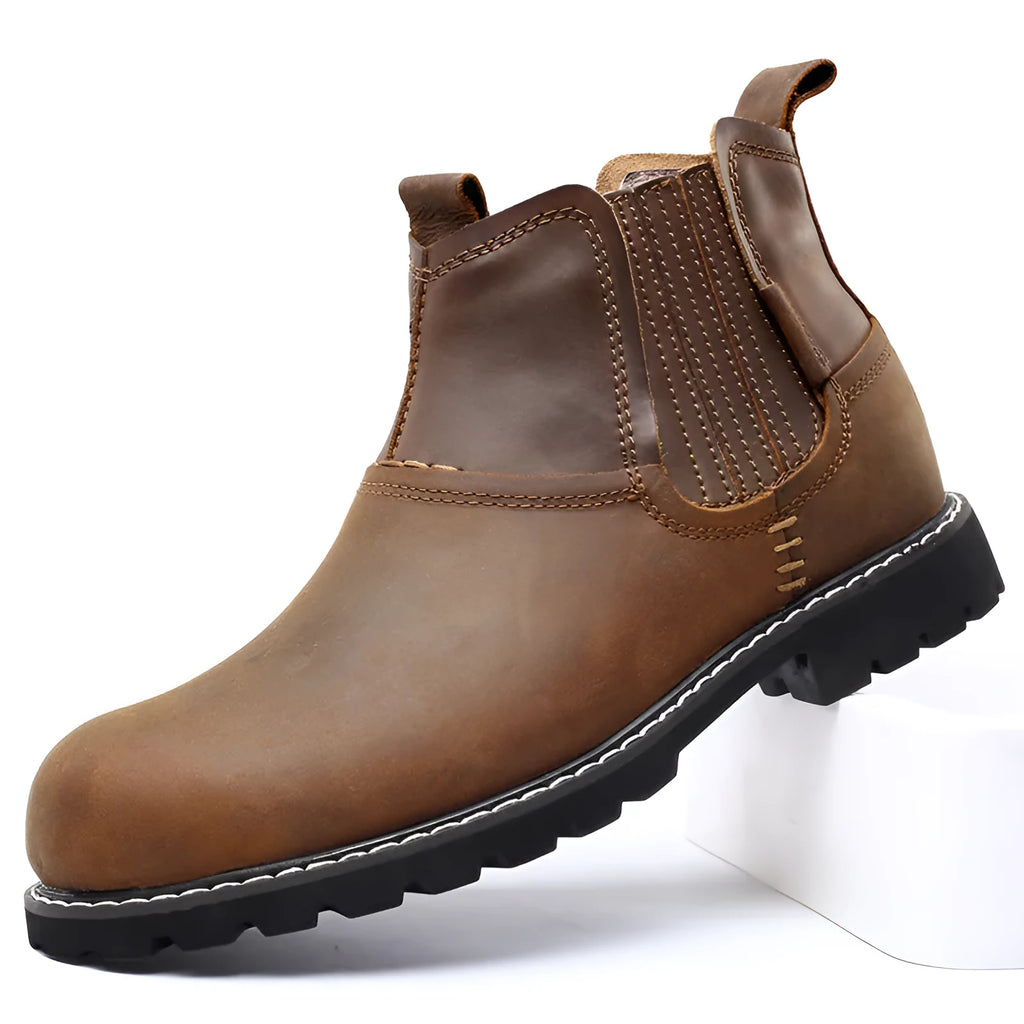 Men's round toe ankle boots in black with lace-up closure and rubber sole on outdoor ground