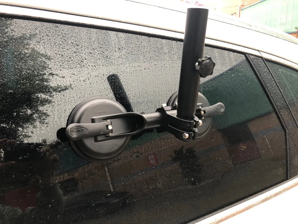 Black off-road car sucker base with round rubber suction cup for mounting on vehicle windows.