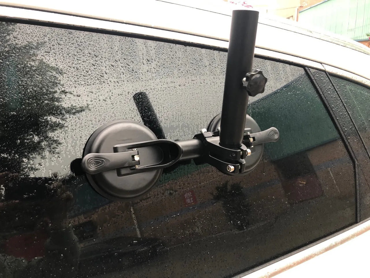 Black off-road car sucker base with round rubber suction cup for mounting on vehicle windows.