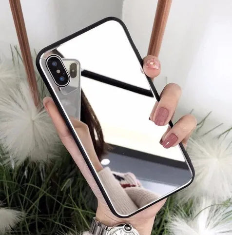 Black iPhone mirror phone case showing reflective surface on back, compatible with iPhone X and Plus models.