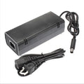 Black Xbox 360 E AC power adapter with detachable cable and UK/EU/US plug options