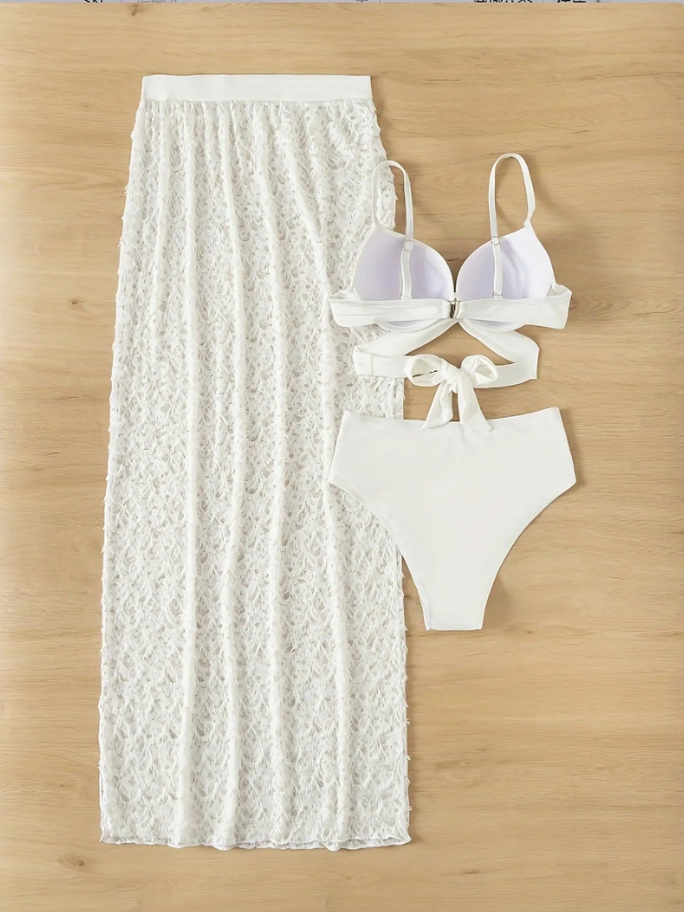 White three-piece swimsuit set with long gathered skirt, sleeveless top, and matching pants for swimming