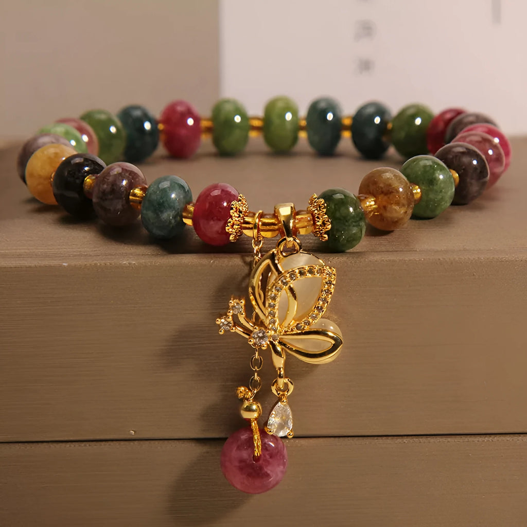 Colourful women's bracelet with a silver butterfly charm and multicoloured beads including tourmaline