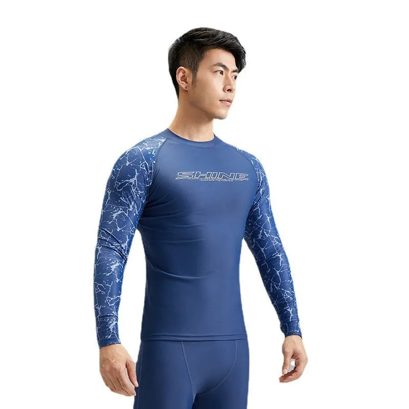 Men's dark blue patterned nylon swimwear set consisting of a top and trousers.