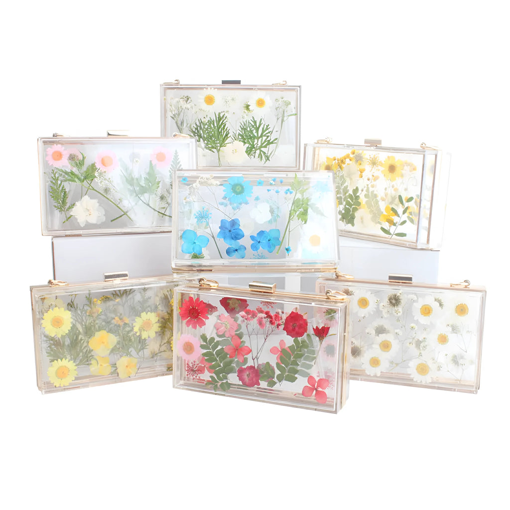 Acrylic transparent flower shoulder messenger bag with hard outer, horizontal square shape, O-shaped necklace, shown in blue.