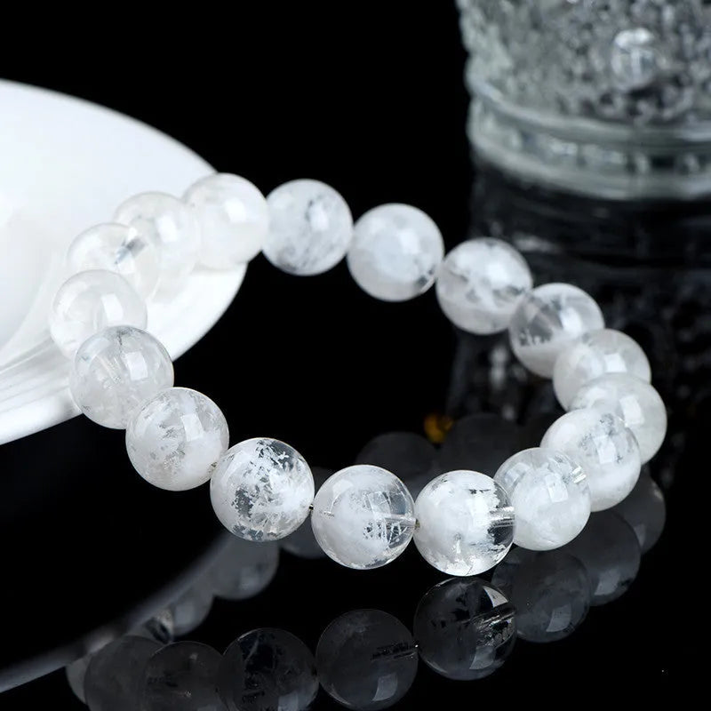 Crystal bracelet with natural blizzard pattern showing Ruyi and Xiangyun elements on round beads