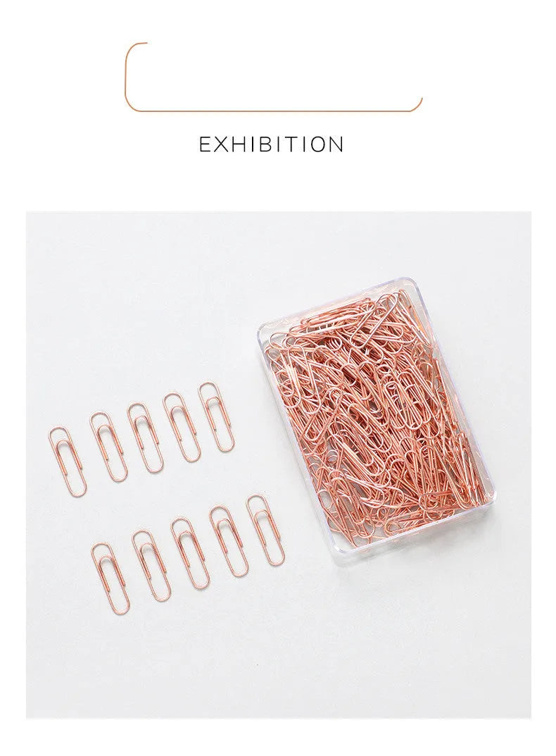 Rose gold heart-shaped metal paper clips in a box, size 28mm.