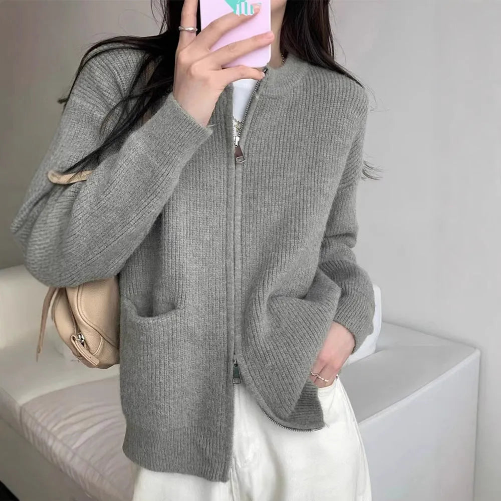 Beige viscose fibre long-sleeve sweater coat cardigan laid flat, showing soft drape and button front.