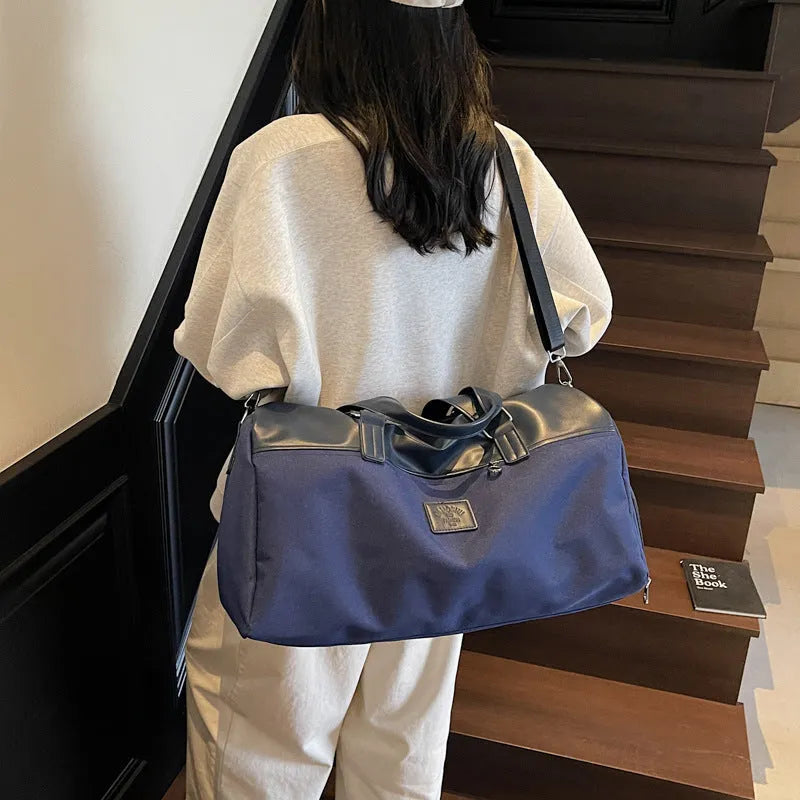Large capacity oxford cloth messenger bag in black, blue, or khaki colours with breathable lining