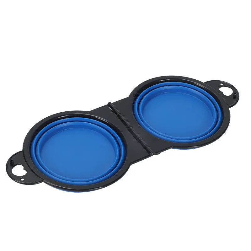 Blue silicone folding pet bowl showing two compartments for food and water in unfolded position