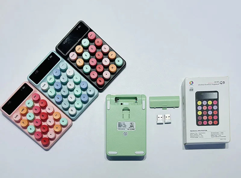 Mini portable wireless keyboard in a macaron colour option on a desk.