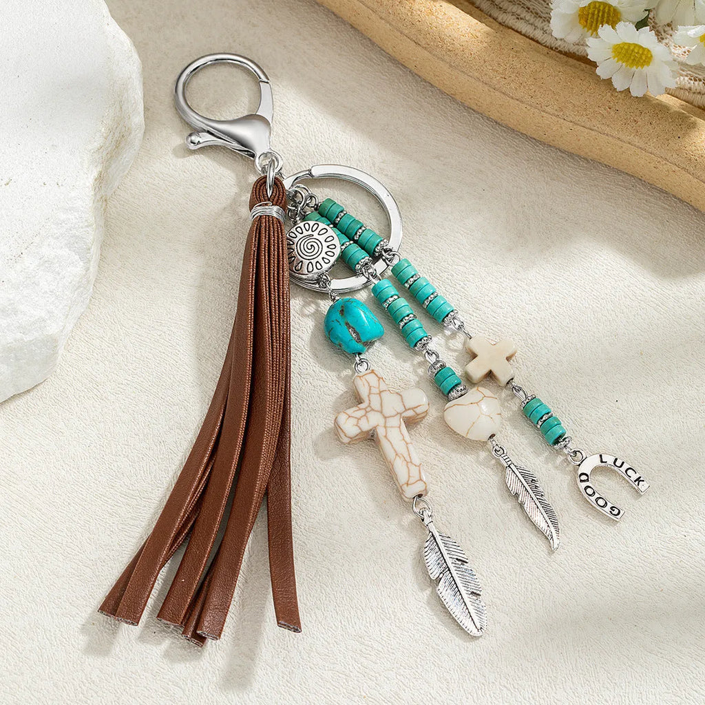 Retro cross alloy keychain pendant with leather rope tassel in colour XY-3669 for suitcase or bag decoration