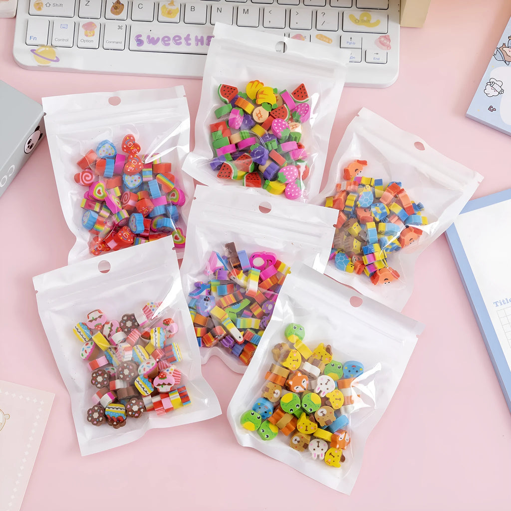 Assortment of 50 small colourful cartoon fruit and animal themed TPR rubber mini erasers.
