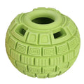 Green natural rubber food dropping ball dog toy for treat dispensing on a white background.