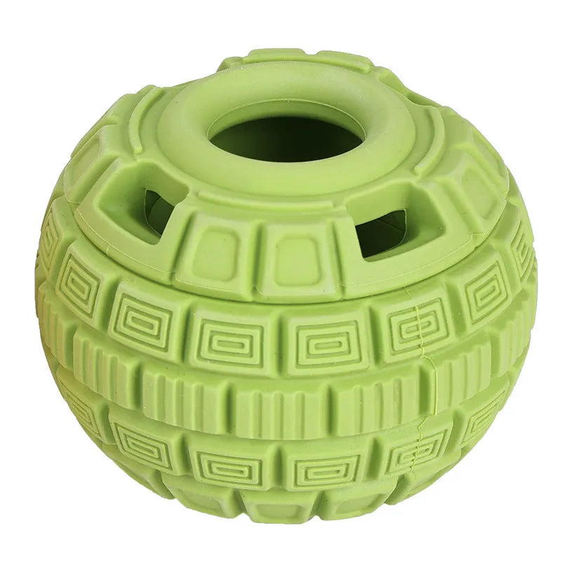 Green natural rubber food dropping ball dog toy for treat dispensing on a white background.