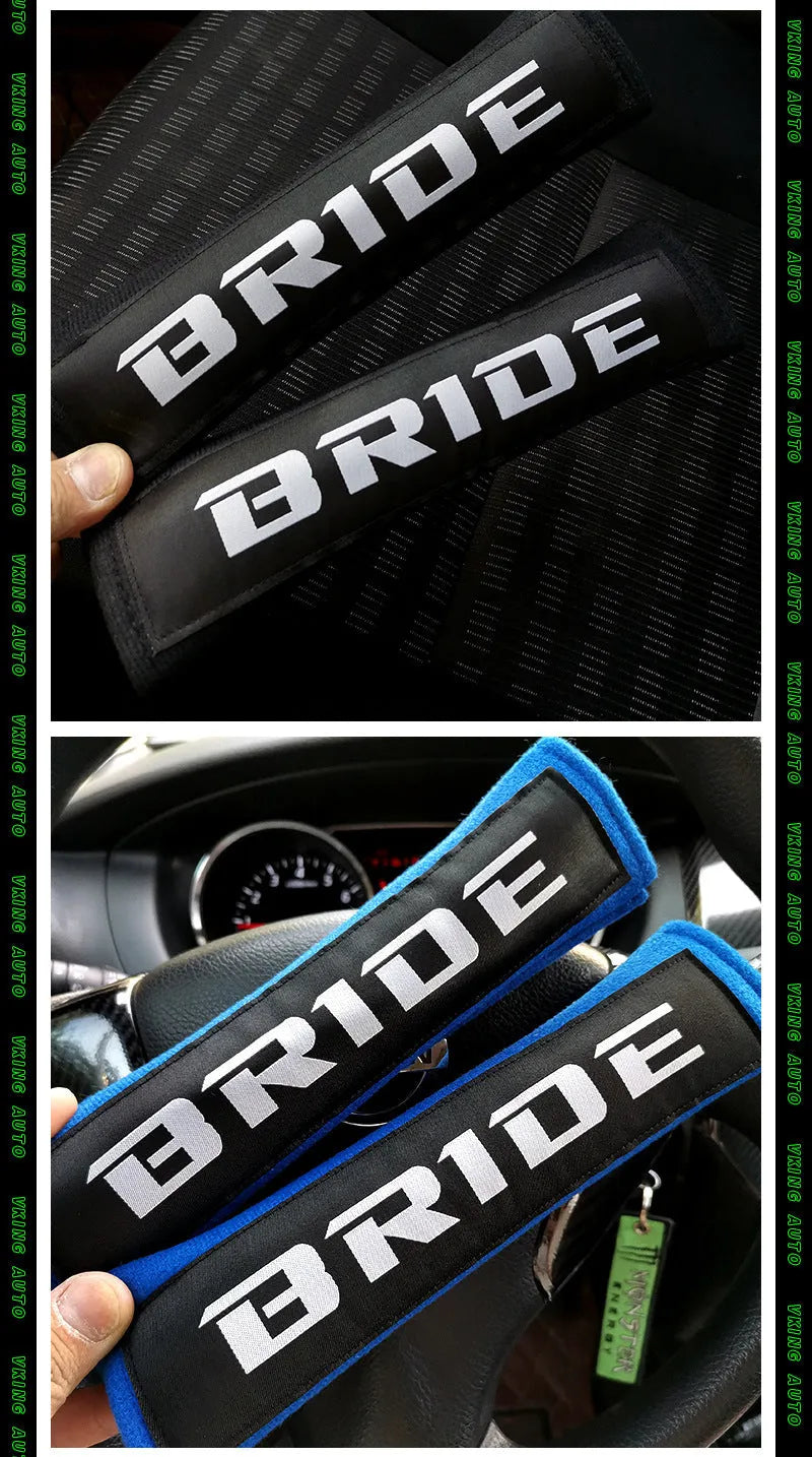 Pair of black car safety belt shoulder pads showing sponge cloth padding and embroidery detail