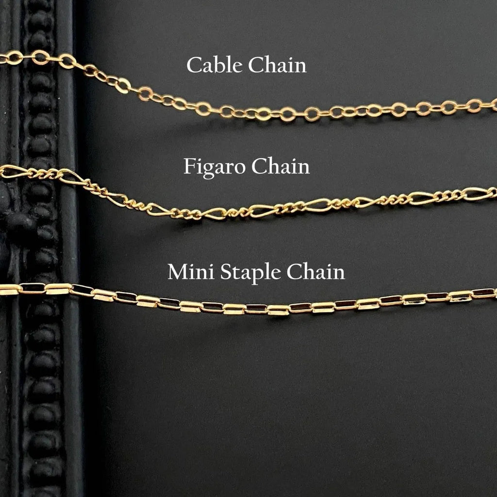 Ghost motif pendant necklace on a twisted stainless steel chain, available in Cable, Figaro, or Mini Staple chain styles.