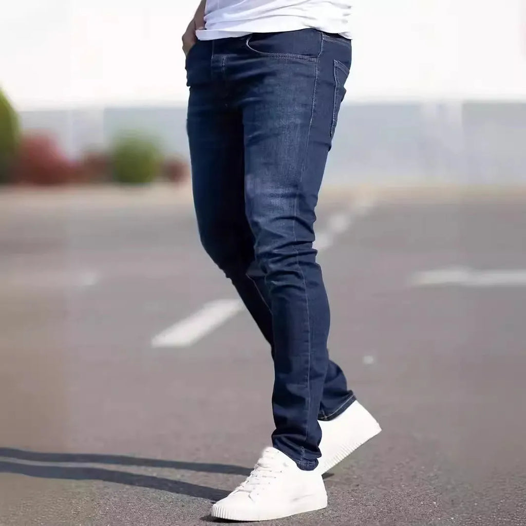 Men's slim-fit dark blue casual jeans with a worn wash and medium elastic cotton fabric.