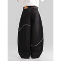 Black straight-leg denim trousers with a mid-waist fit and zip fly, laid flat.