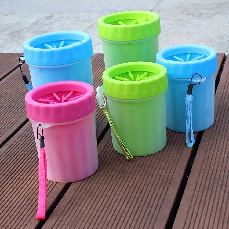 Blue silicone and plastic dog foot washing barrel with drainage hole for muddy paws