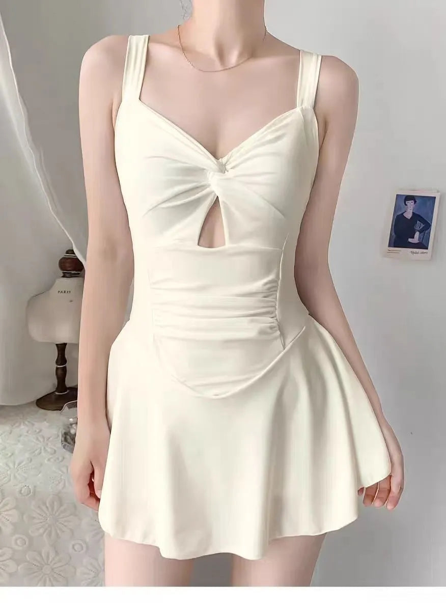 Women's solid colour conservative one-piece swimsuit with backless design