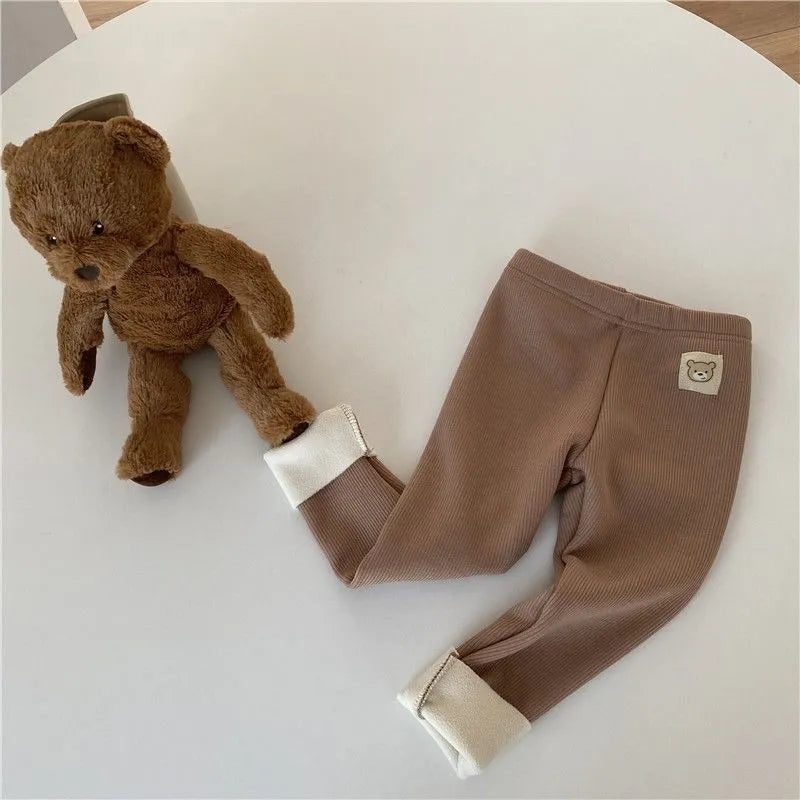 Girls' high-waisted fleece-lined leggings in beige, black, brown, and grey colours with a wool lining.