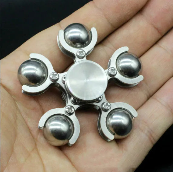 Silver spinning creative ferris wheel fingertip gyro on a neutral background