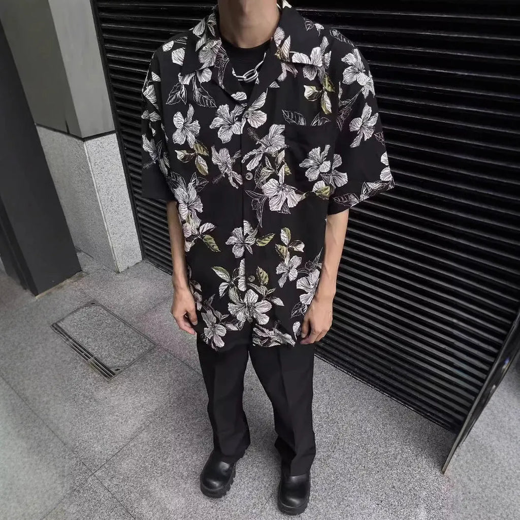 Black men's short-sleeve Cuban collar shirt with floral print, made from ice silk fabric.