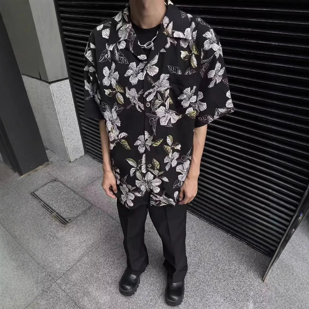 Black men's short-sleeve Cuban collar shirt with floral print, made from ice silk fabric.